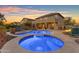 Stunning backyard pool and spa, complete with lounge chairs and a cozy fire pit for relaxation at 18187 E Via Jardin --, Gold Canyon, AZ 85118