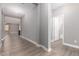 Bright and airy entryway featuring hard wood flooring and neutral walls at 1827 S 237Th Dr, Buckeye, AZ 85326