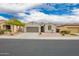 Charming single-story home with a well-manicured front yard and two car garage at 1827 S 237Th Dr, Buckeye, AZ 85326