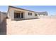 A spacious backyard features a covered patio and a blank canvas for outdoor landscaping at 1910 E Empeltre Rd, San Tan Valley, AZ 85140