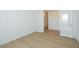 Bedroom features wood-look flooring and double glass doors at 1910 E Empeltre Rd, San Tan Valley, AZ 85140