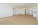 Spacious living room with plank flooring, white walls, and bright recessed lighting at 1910 E Empeltre Rd, San Tan Valley, AZ 85140