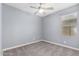 Bright bedroom with neutral gray walls, carpet, and a window at 19740 W Sherman St, Buckeye, AZ 85326