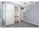 Comfortable bedroom featuring a ceiling fan, closet, and carpet at 19740 W Sherman St, Buckeye, AZ 85326