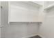 A well-organized closet with white walls, shelving, and a clothing rod at 19740 W Sherman St, Buckeye, AZ 85326