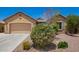 Charming single-story house with a two-car garage and desert landscaping at 19740 W Sherman St, Buckeye, AZ 85326