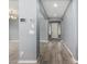 Elegant foyer with wood-look tile flooring, gray walls and chandelier at 19740 W Sherman St, Buckeye, AZ 85326