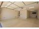 Bright garage with an automatic door, water heater, and neutral walls at 19740 W Sherman St, Buckeye, AZ 85326