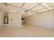 Spacious garage with painted floor, water heater, and overhead lighting at 19740 W Sherman St, Buckeye, AZ 85326