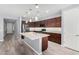 Modern kitchen featuring granite countertops, stainless steel appliances, and a central island at 19740 W Sherman St, Buckeye, AZ 85326