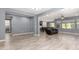 Open-concept living room featuring luxury hardwood flooring and open access to the kitchen at 19740 W Sherman St, Buckeye, AZ 85326