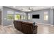 Comfortable living room featuring hardwood floors, gray walls, and backyard view at 19740 W Sherman St, Buckeye, AZ 85326