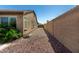 The property features a low-maintenance side yard with desert landscaping and a secure block wall at 19740 W Sherman St, Buckeye, AZ 85326