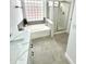 Bathroom featuring a large soaking tub, a glass-enclosed shower, and a marble countertop at 20917 N 37Th Pl, Phoenix, AZ 85050