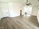 Spacious living room featuring modern flooring and a vaulted ceiling with a fan at 20917 N 37Th Pl, Phoenix, AZ 85050