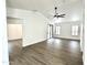 Spacious living room featuring modern flooring and a vaulted ceiling with a fan at 20917 N 37Th Pl, Phoenix, AZ 85050