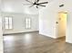 Spacious living room featuring wood-look floors and two large windows at 20917 N 37Th Pl, Phoenix, AZ 85050