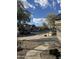 View of a tree-lined street featuring well-maintained homes and xeriscaped yards on a sunny day at 20917 N 37Th Pl, Phoenix, AZ 85050