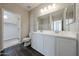 Bathroom with double sink vanity and walk-in closet at 2150 W Alameda Rd # 1122, Phoenix, AZ 85085