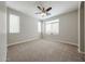 Well-lit bedroom with a ceiling fan and neutral carpeting at 2150 W Alameda Rd # 1122, Phoenix, AZ 85085