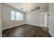 Dining area with hardwood floors, chandelier lighting, and bright natural light at 2150 W Alameda Rd # 1122, Phoenix, AZ 85085