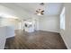 Open-concept living room with wood-look flooring and access to the modern kitchen at 2150 W Alameda Rd # 1122, Phoenix, AZ 85085