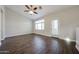 Living room featuring wood-look tile flooring, a window, and door to outside at 2150 W Alameda Rd # 1122, Phoenix, AZ 85085