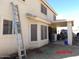 View of the back exterior of a home in the midst of some repair and yard work at 22016 W Loma Linda Blvd, Buckeye, AZ 85326