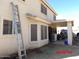 Back exterior view of a two-story home with covered patio at 22016 W Loma Linda Blvd, Buckeye, AZ 85326