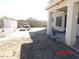 Backyard with partial landscaping and partially covered patio at 22016 W Loma Linda Blvd, Buckeye, AZ 85326