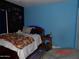 Eclectic bedroom with a chalkboard wall, a double bed, and blue accents at 22016 W Loma Linda Blvd, Buckeye, AZ 85326