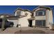 Inviting two-story home featuring desert landscaping, neutral tones, and a welcoming entrance at 22016 W Loma Linda Blvd, Buckeye, AZ 85326