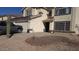 Inviting two-story home featuring desert landscaping, neutral tones, and a welcoming entrance at 22016 W Loma Linda Blvd, Buckeye, AZ 85326