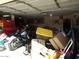 Garage with storage and parked motorcycle at 22016 W Loma Linda Blvd, Buckeye, AZ 85326