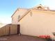 View of the side exterior of a home with a fence and stucco wall at 22016 W Loma Linda Blvd, Buckeye, AZ 85326