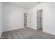 Bright bedroom with a neutral palette and walk-in closet provides a comfortable and inviting space at 24116 N 172Nd Ave, Surprise, AZ 85387