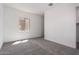 This bedroom has neutral walls and carpeting plus a window at 24116 N 172Nd Ave, Surprise, AZ 85387