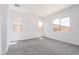 Comfortable bedroom with neutral carpet and large windows for natural light at 24116 N 172Nd Ave, Surprise, AZ 85387