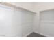 Bright and well-organized walk-in closet offers ample storage space with shelving and rods at 24116 N 172Nd Ave, Surprise, AZ 85387