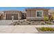 Beautiful home exterior with a well-manicured lawn and a two-car garage, showcasing curb appeal at 24116 N 172Nd Ave, Surprise, AZ 85387