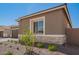 Inviting single-story home showcases stone details and manicured landscaping, creating a welcoming entrance at 24116 N 172Nd Ave, Surprise, AZ 85387