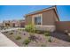 Charming single-story home featuring stone accents and manicured landscaping for curb appeal at 24116 N 172Nd Ave, Surprise, AZ 85387
