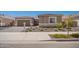 Charming single-story home features a two-car garage and landscaped front yard at 24116 N 172Nd Ave, Surprise, AZ 85387
