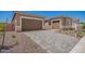 Spacious two-car garage with a paved driveway, offering ample parking and convenient access to the home at 24116 N 172Nd Ave, Surprise, AZ 85387