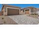 Spacious two-car garage with a paved driveway, offering ample parking and convenient access to the home at 24116 N 172Nd Ave, Surprise, AZ 85387