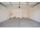 Spacious two car garage offering ample parking and storage with clean epoxy flooring at 24116 N 172Nd Ave, Surprise, AZ 85387