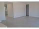 Spacious living room with tile flooring and neutral walls providing a blank canvas at 24116 N 172Nd Ave, Surprise, AZ 85387