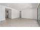 Spacious living room with light tile flooring and ample natural light at 24116 N 172Nd Ave, Surprise, AZ 85387