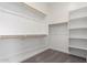 This is a walk-in closet with multiple racks and shelves at 24116 N 172Nd Ave, Surprise, AZ 85387