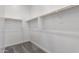 This is a walk-in closet with multiple racks at 24116 N 172Nd Ave, Surprise, AZ 85387